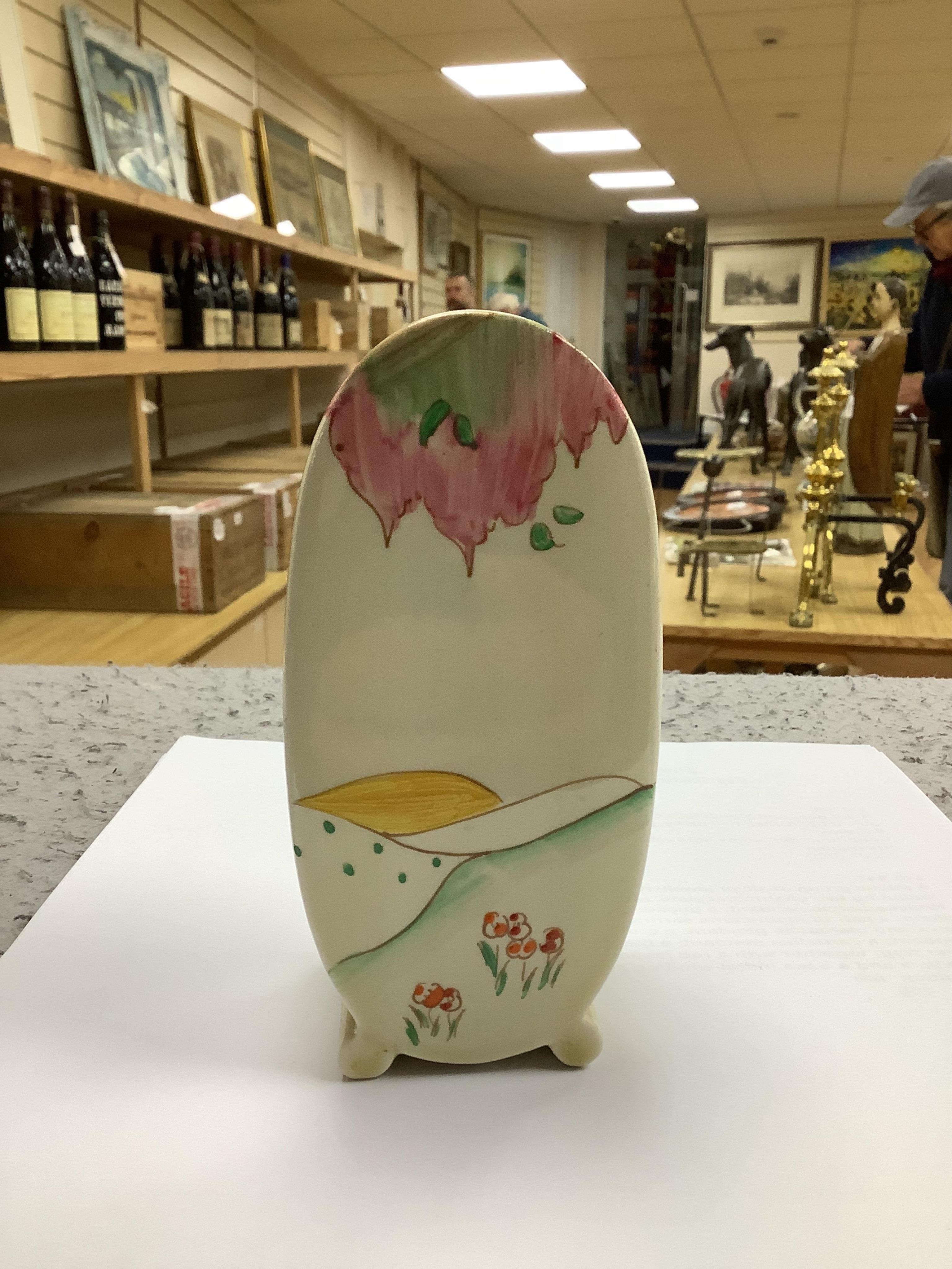 A Clarice Cliff Bonjour shaped sugar sifter, 12.5cm high. Condition - good